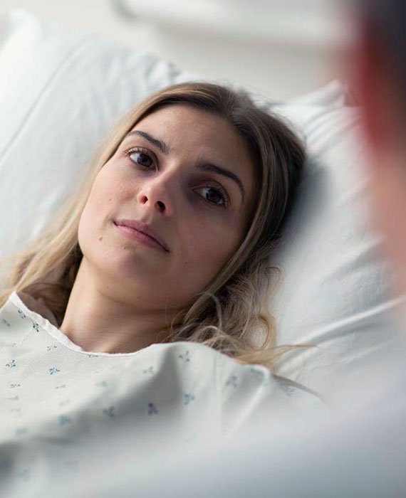 Patient looking up at nurse