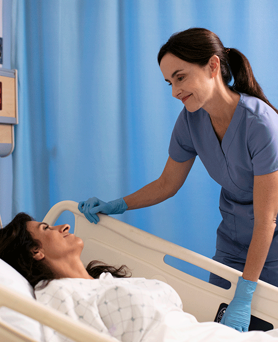 Physician at bedside with patient