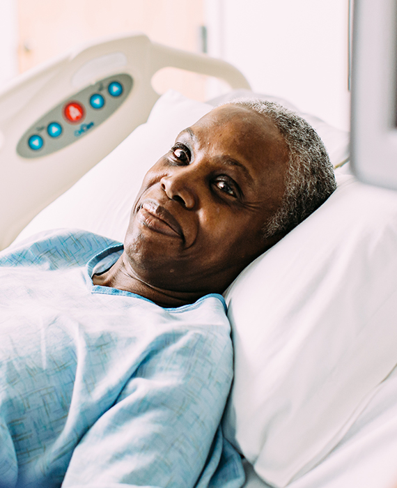 Patient laying in hospital bed